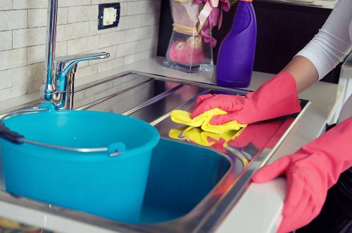 Cleaning team meticulously dusting surfaces in a newly built home